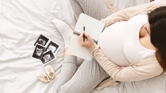 pregnant person writing a list