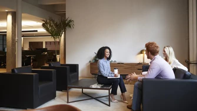 Coworkers talking at work